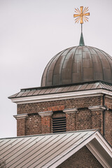 Canvas Print - Vertical shot of an old church with a cross on top