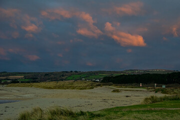 Penzance Bay under red dawn clouds