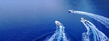 Aerial Drone Ultra Wide Top Down Photo Of Synchronised Powerboats Cruising In High Speed In Deep Blue Open Ocean Sea