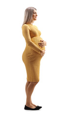 Wall Mural - Pregnant woman in a yellow dress holding her belly