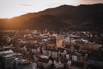 Poster - Beautiful high angle view of the residential buildings under the bright sunset