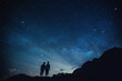 Silhouette of elderly couple on the hill.  Stargazing at Oahu island, Hawaii. Starry night sky, Milky Way galaxy astrophotography.