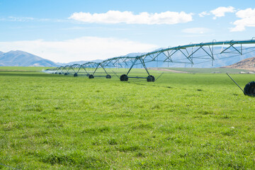 Canvas Print - Lateral irrigation system across flat farmland