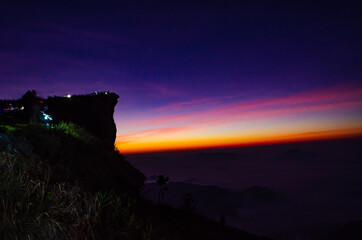 Wall Mural - The sun rises in the morning at Phu Chi Fa, Chiang Rai, Thailand.