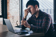 © panitan - sad depression serious people from work,study stress concept.asian man feeling tired suffering using computer working work place.concept global economic,health problems