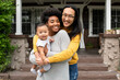 © Rawpixel.com - Cute multiethnic family standing at the porch during covid19 lockdown