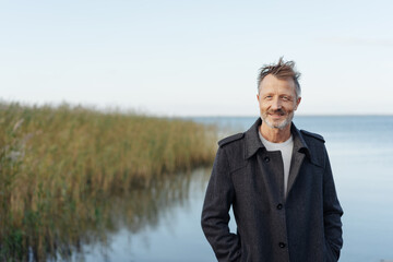 Friendly middle-aged man in trench coat