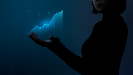 Wall Mural - Business person holding a digitally generated growing graph