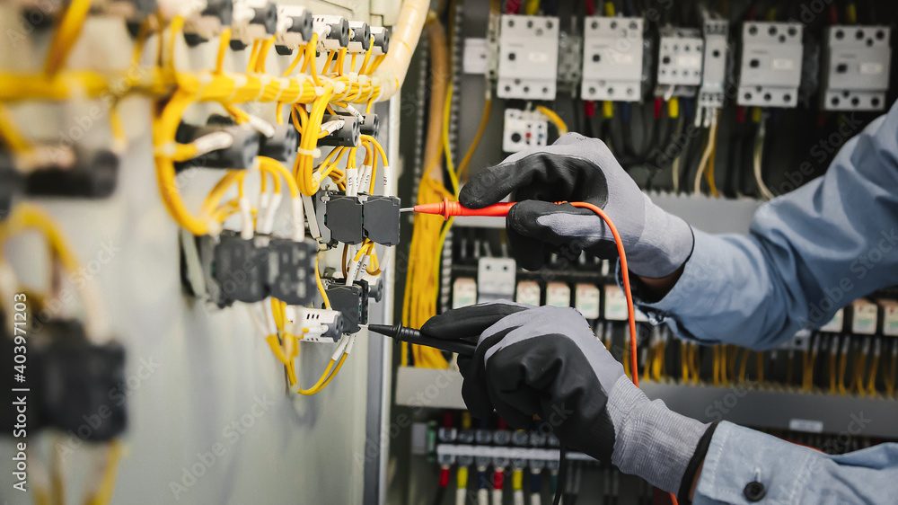 Electrical engineers test electrical installations and wiring on ...