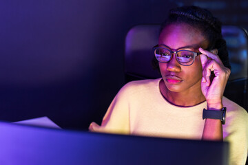 Female web developer writing source code