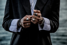 Closeup Shot Of The Hands Of A Stylish African American Male With Rings