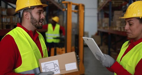 Wall Mural - Mature woman with tablet and young man with package working in warehouse - Industry and logistics occupation