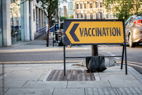 Vaccination sign by the road. Banner for Covid-19 vaccination campaign. Gaining herd immunity