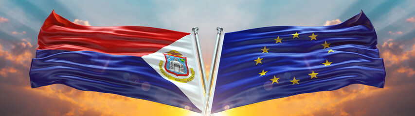 Double Flag European Union and Sint Maarten flag waving flag with texture sky clouds and sunset background