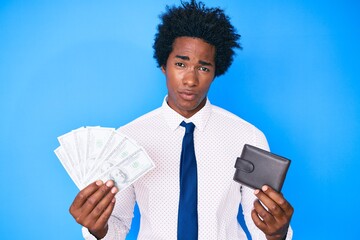 Sticker - Handsome african american man with afro hair holding wallet and dollars banknotes skeptic and nervous, frowning upset because of problem. negative person.