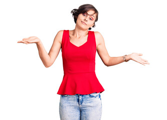 Poster - Beautiful young woman with short hair wearing casual style with sleeveless shirt clueless and confused expression with arms and hands raised. doubt concept.