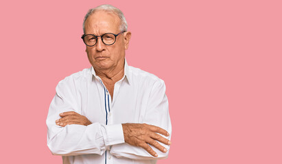 Poster - Senior caucasian man wearing business shirt and glasses skeptic and nervous, disapproving expression on face with crossed arms. negative person.