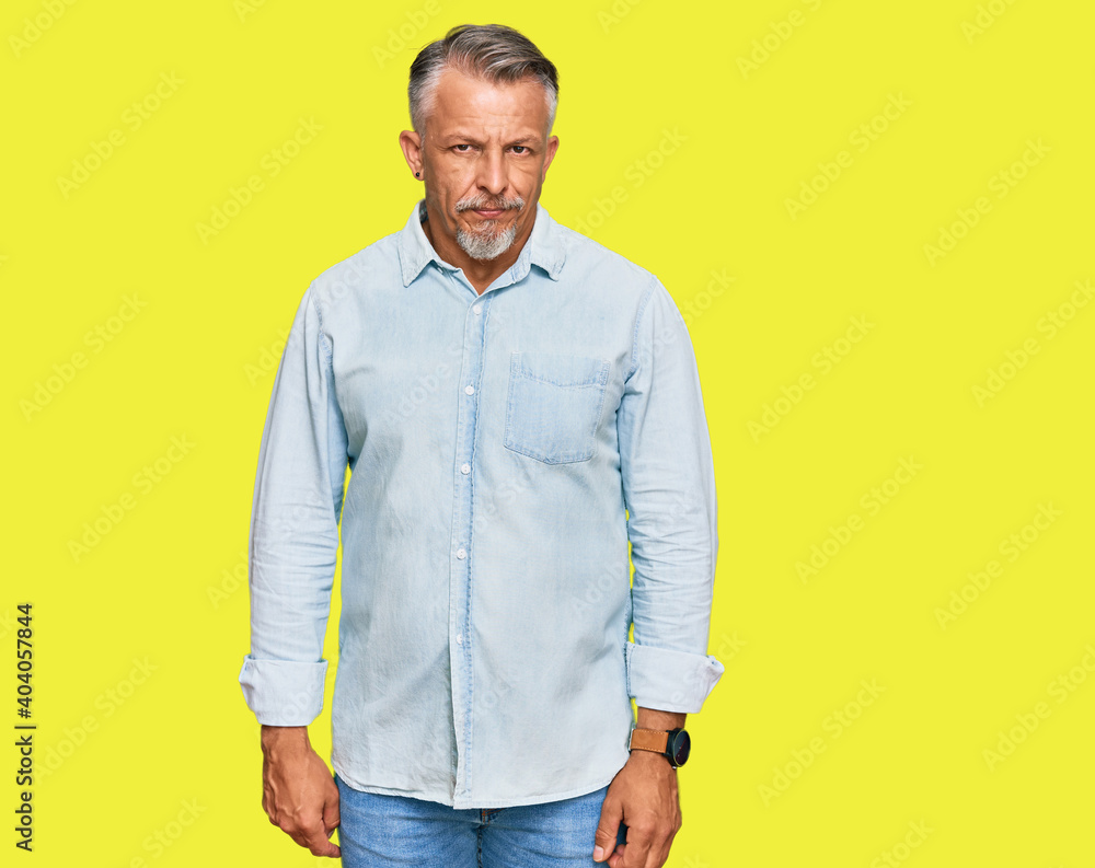 Middle age grey-haired man wearing casual clothes skeptic and nervous, frowning upset because of problem. negative person.