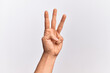 © Krakenimages.com - Hand of caucasian young man showing fingers over isolated white background counting number 3 showing three fingers
