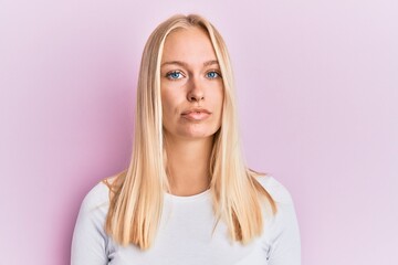 Sticker - Young blonde girl wearing casual clothes relaxed with serious expression on face. simple and natural looking at the camera.