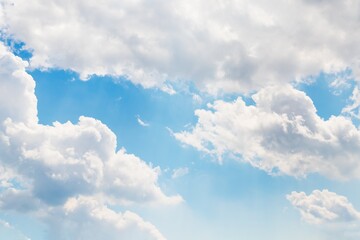 Wall Mural - Beautiful white fluffy clouds on a blue sky background