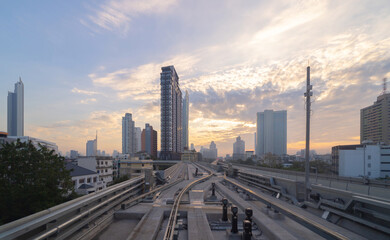 Train view on railway in Bangkok Downtown to Icon Siam at financial district, skyscraper buildings in urban city, Thailand. Transportation for tourists visiting in travel trip or holiday vacation.