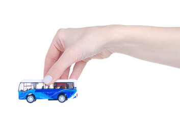 Toy model bus in hand on white background isolation