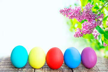 colorful easter eggs on flower background with copy space. Easter background
