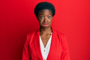 Poster - Young african american girl wearing business clothes puffing cheeks with funny face. mouth inflated with air, crazy expression.