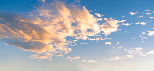 blue sky with golden yellow clouds at sunset or sunrise