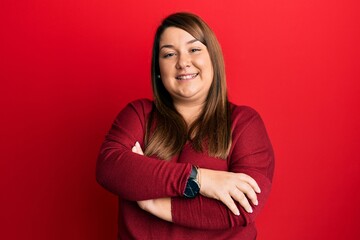 Wall Mural - Beautiful brunette plus size woman wearing casual clothes happy face smiling with crossed arms looking at the camera. positive person.