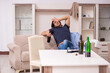 © Elnur - Young unemployed man drinking alcohol at home