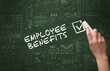 © ra2 studio - Hand drawing EMPLOYEE BENEFITS inscription with white chalk on blackboard, new business concept