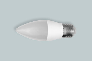 Electric saving light bulb on a gray background.