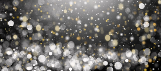 defocused yellow and white lights on a black background.