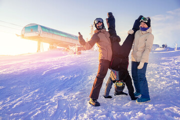 Group of friends with snowboard and ski on winter holidays having fun on snow