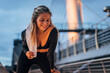 © eastwest photo - young woman smiling after finishing her outdoor workout