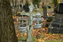 Cracked Stone Christian Cross In An Orthodox Cemetery In Autumn