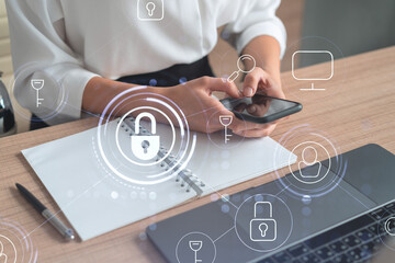 Poster - A woman programmer is browsing the Internet in smart phone to protect a cyber security from hacker attacks and save clients confidential data. Padlock Hologram icons over the typing hands. Formal wear