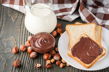 Wall Mural - toasts with chocolate butter on a dark wooden rustic background