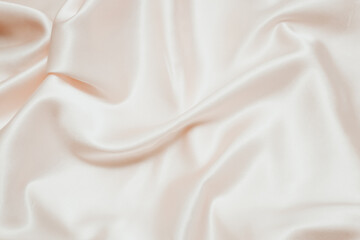 Wall Mural - Powdery pink texture of silk, satin. Shiny fabric background.