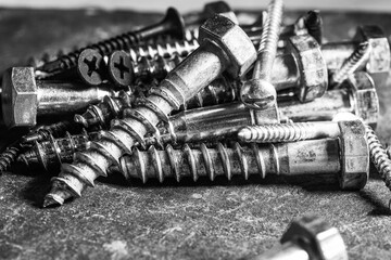 Group of screws on a table in a Workshop