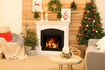 Wall Mural - Beautiful living room interior with burning fireplace. Christmas celebration