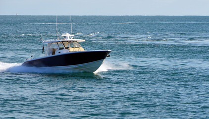 Wall Mural - Fishing boat returning to Port of Miami after a day at sea.