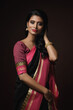 Beautiful Indian woman wearing traditional sari dress