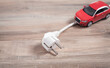 © andranik123 - Red toy car with electrical plug. Electric car