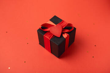 Black gift boxes with red ribbon on white background. The Concept Of Valentine's Day.