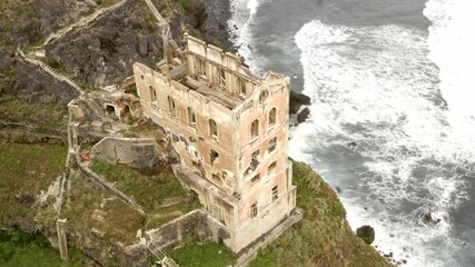 Wall Mural - Aerial view of abandoned factory next to sea