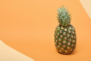 fresh ripe tasty pineapple on a brown background