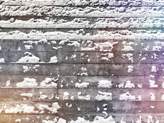 Wall Mural - Abstract background of a concrete wall in the snow with colored spots. Concept for designers.